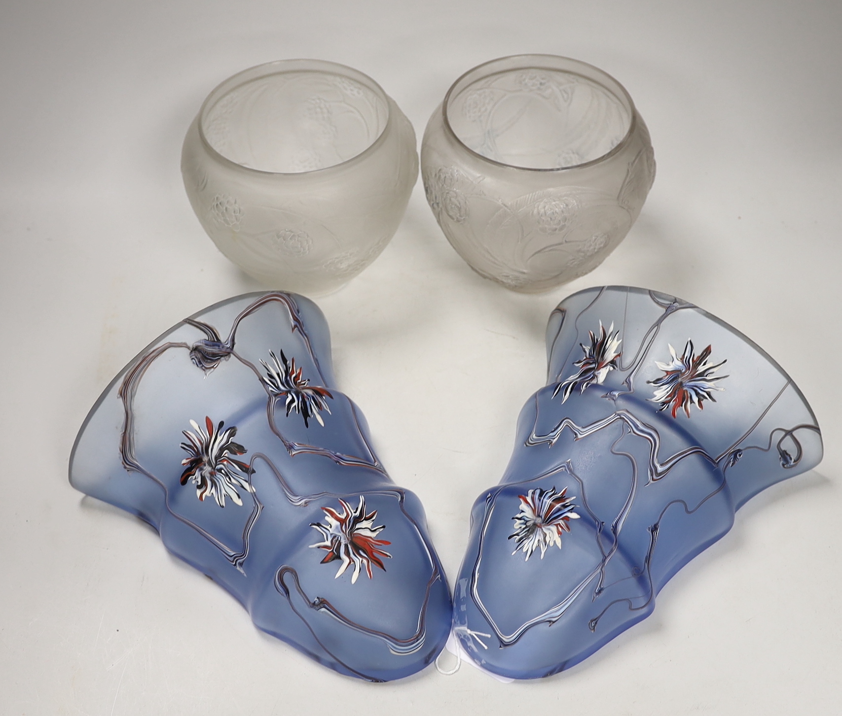 Two R. Lalique Nefliers vases, 14cm high, and a pair of blue enamelled glass wall pockets